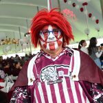A fan in face paint and Fordham gear inside the Homecoming tent.