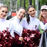 President Tetlow poses with cheerleaders