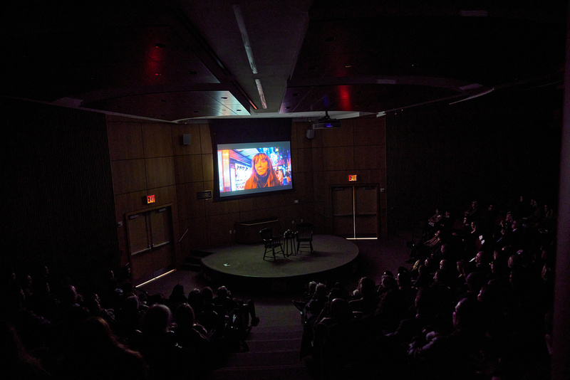 An audience watches Bonnie at Fordham University