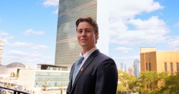 Ian Muir Smith stands in front of the United Nations building in New York City