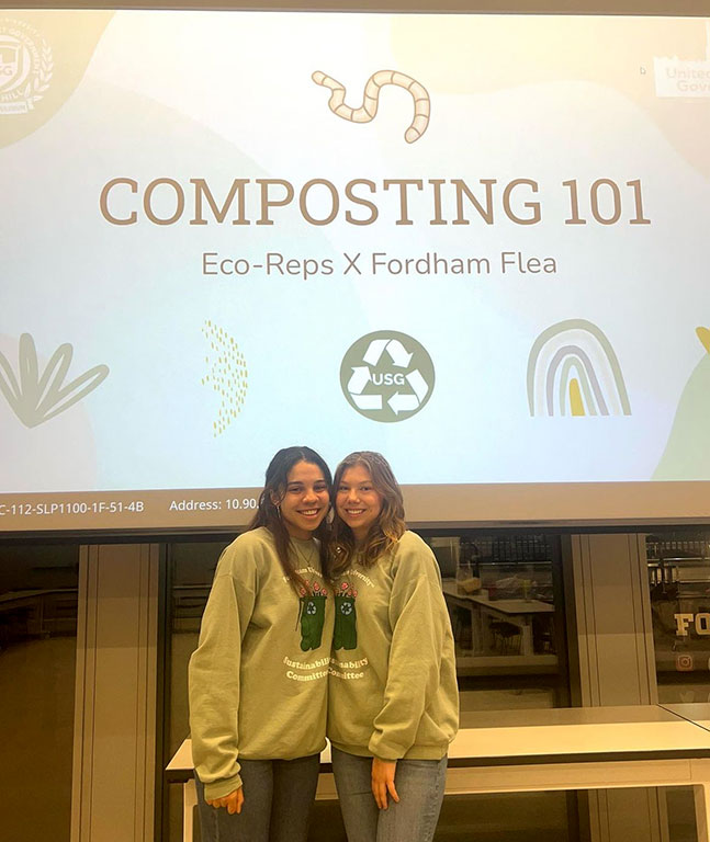 Two students standing next to each other under a banner that says Composing 101
