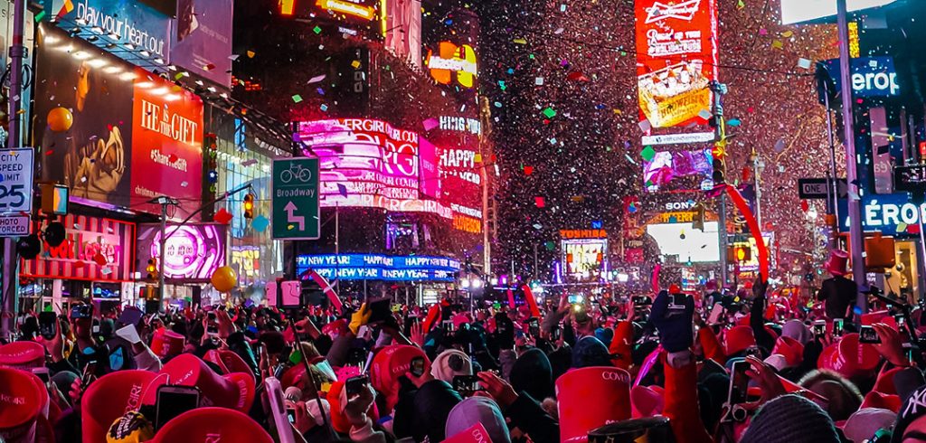 Times Square on New Years Eve, confetti in the air. 