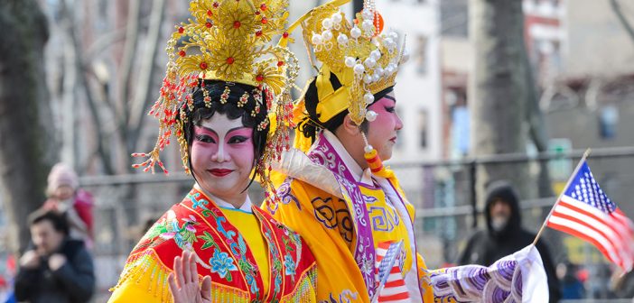 Two women dressed in cultural attire for Chinese New Year Parade