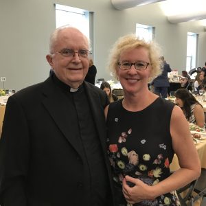 Father Daly with an alumna