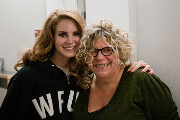Lana Del Rey and Rita Houston at the WFUV studio in 2011. Del Rey is wearing a WFUV hoodie and has her arm around Houston.