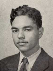 A black and white portrait of Donald Clarke as a young adult