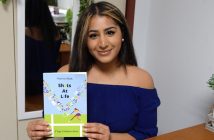 Nazeen Shah holds a copy of her book "Shots at Life."