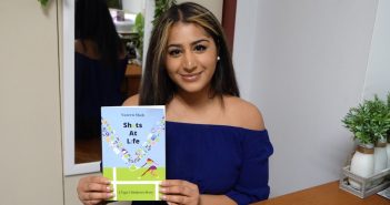 Nazeen Shah holds a copy of her book "Shots at Life."